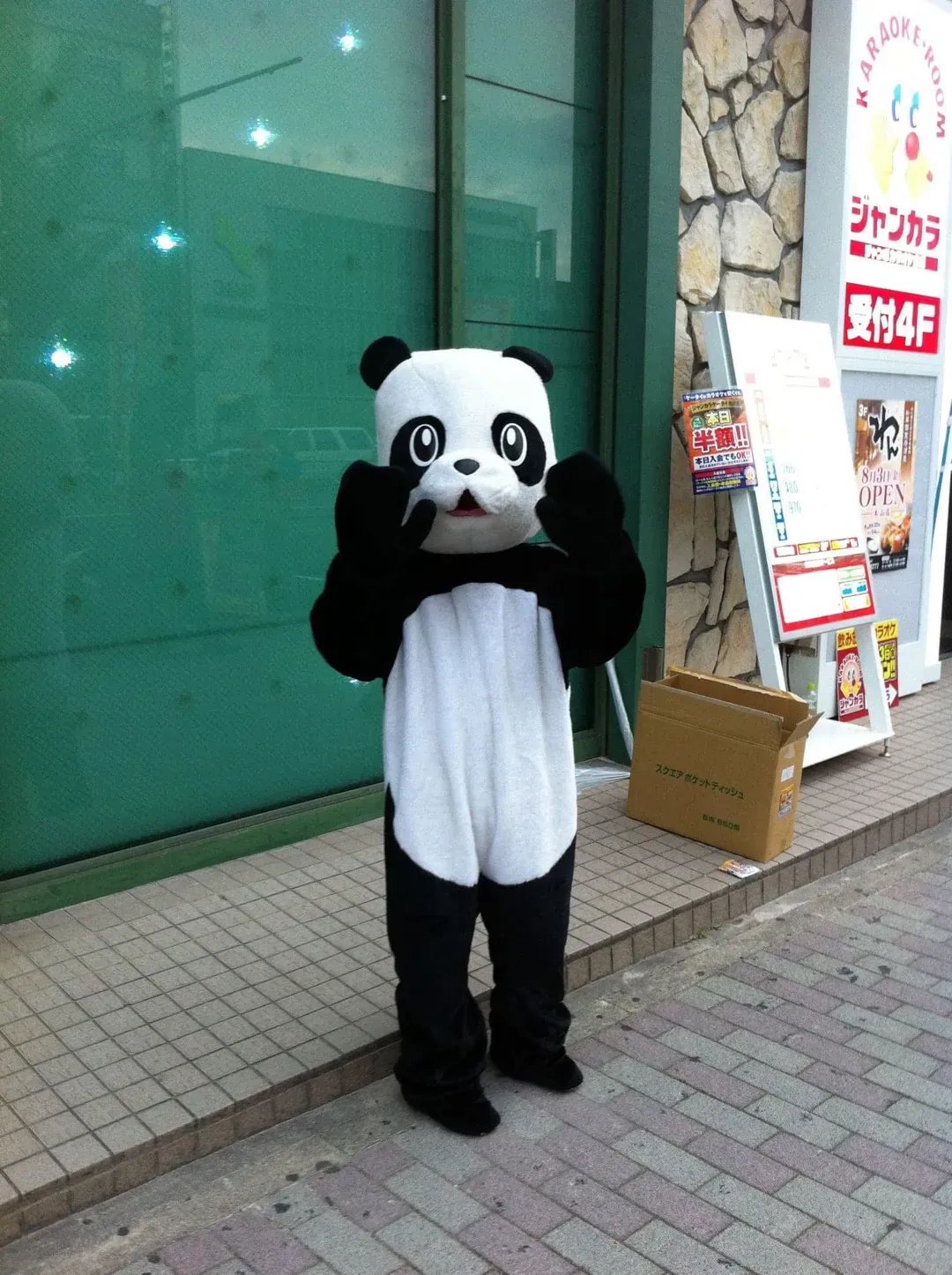 Melting panda mascot on Nagoya sidewalk